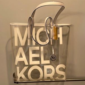 NWT Michael Kora graphic clear tote bag.  Clear with white lettering.